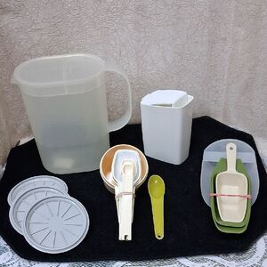 Tupperware vintage 6 cup pitcher, coasters, and lots of sizes measuring utensils